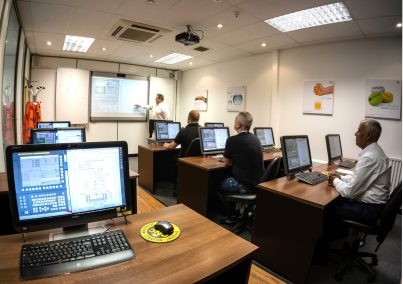 Trainees learning CNC skills