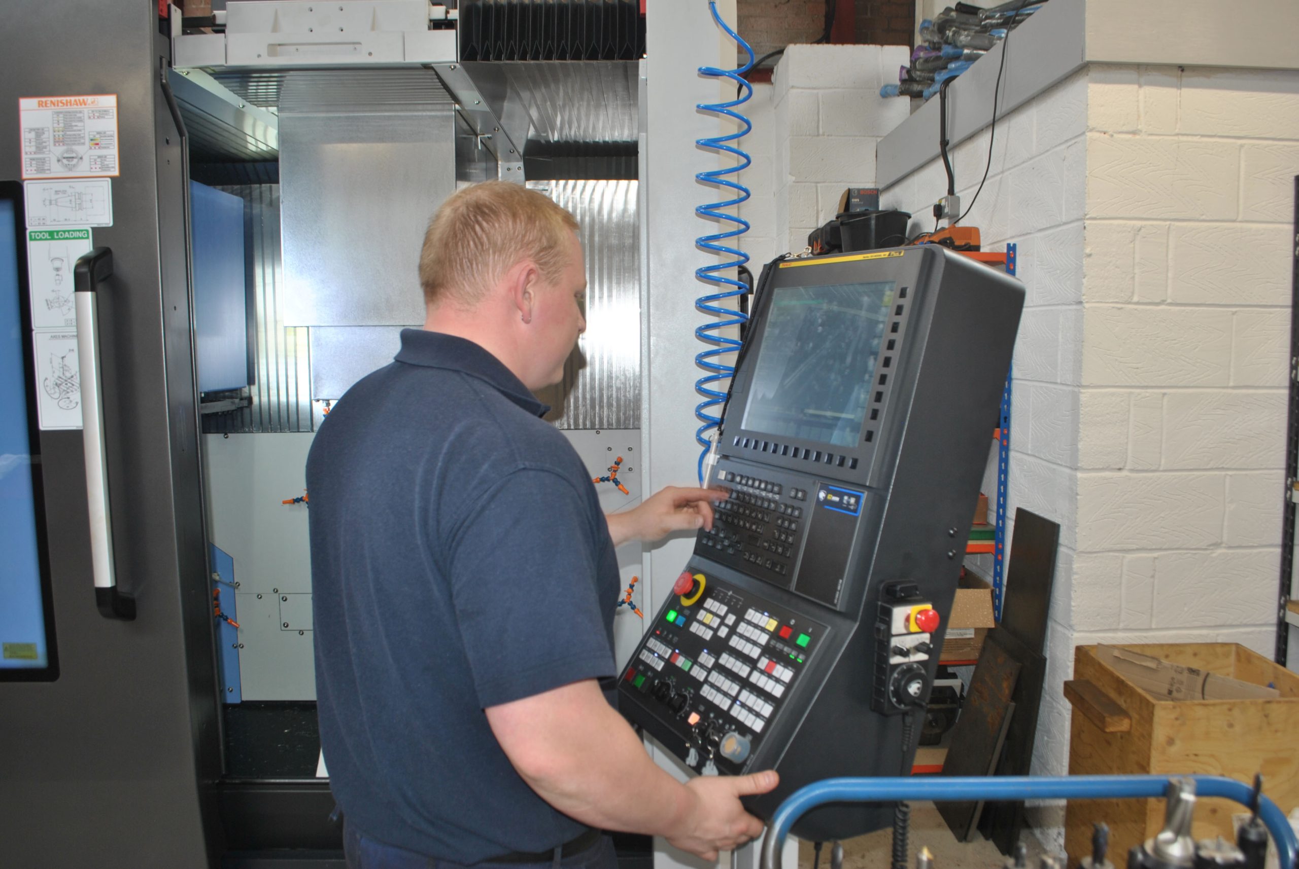 Operator using DVF 5000 Vertical 5-Axis CNC Machining Centre