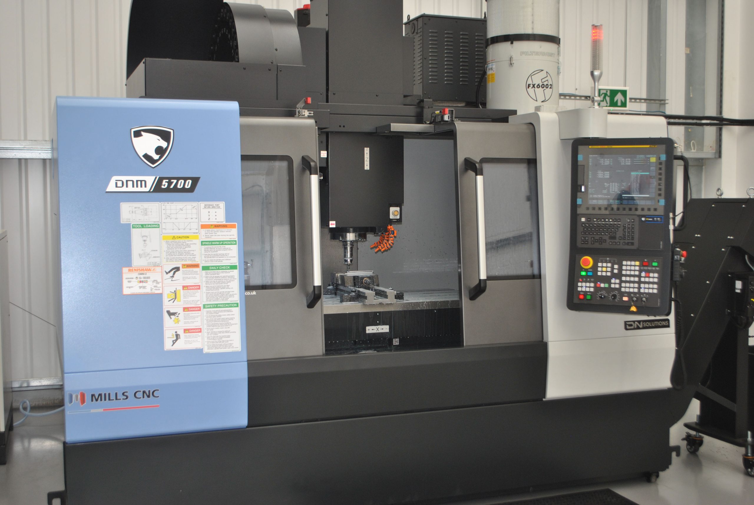 DN Solutions DNM 5700 machining centre with doors open