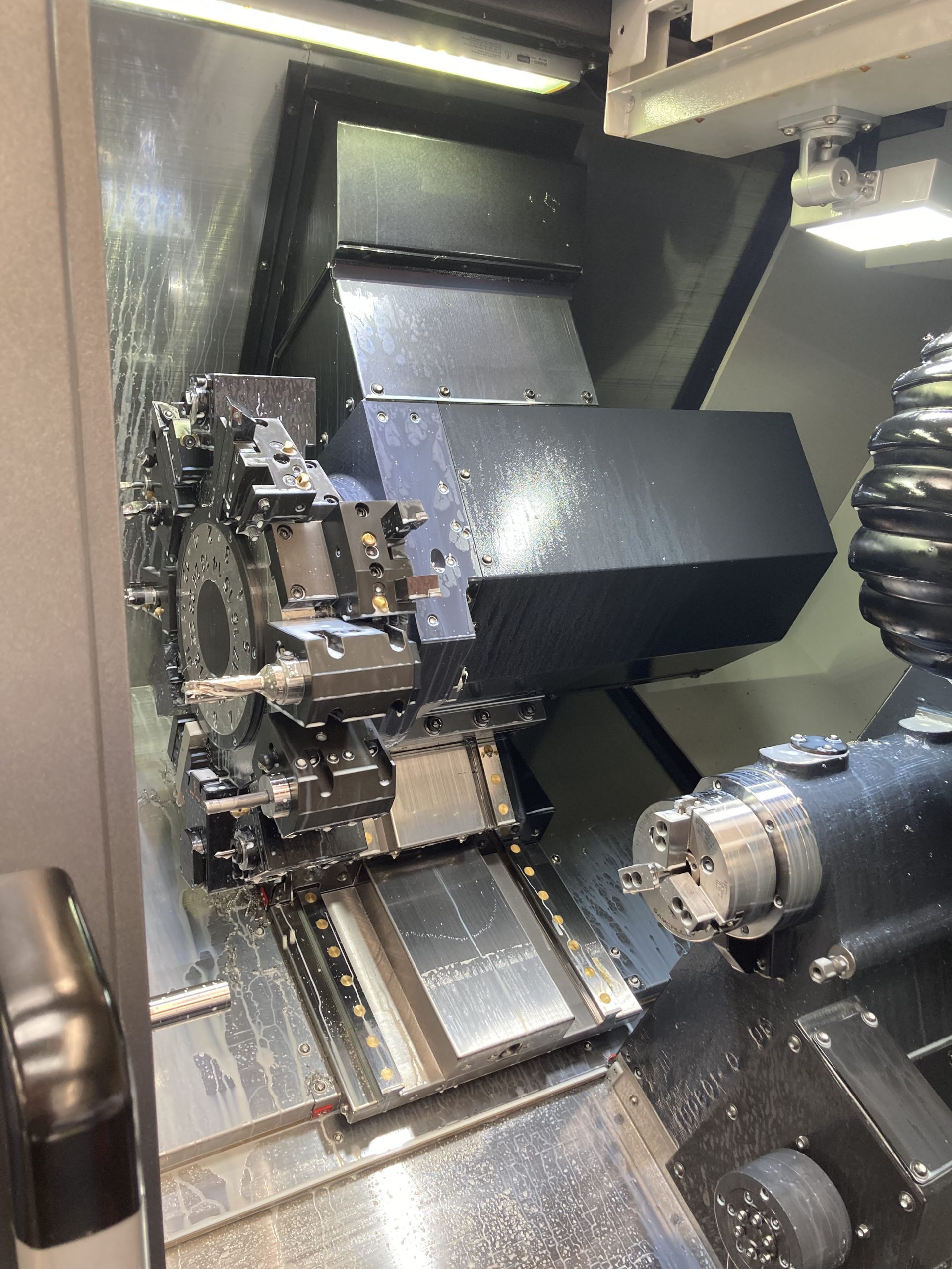 Interior of a DN Solutions’ Lynx 2100LSYB multi-tasking lathe at Monard Precision